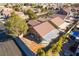 Aerial view of a desert home with tile roof and covered patio in a quiet neighborhood at 551 Morning Mauve Ave, Las Vegas, NV 89183