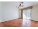 Sun-filled bedroom boasting wood floors, neutral walls, and a ceiling fan at 551 Morning Mauve Ave, Las Vegas, NV 89183