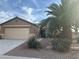 One-story house with attached garage and a palm tree in front at 551 Morning Mauve Ave, Las Vegas, NV 89183