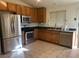 Modern kitchen with stainless steel appliances and wood cabinets at 551 Morning Mauve Ave, Las Vegas, NV 89183