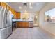 Well-equipped kitchen featuring stainless steel appliances and tile floors at 551 Morning Mauve Ave, Las Vegas, NV 89183