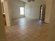 Bright living room with tile floors and access to other rooms at 551 Morning Mauve Ave, Las Vegas, NV 89183