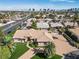 Expansive home with a tile roof with views of the Las Vegas skyline in the background at 5555 W Desert Inn Rd, Las Vegas, NV 89146