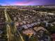 Panoramic aerial view of a residential neighborhood with Las Vegas skyline at dusk at 5555 W Desert Inn Rd, Las Vegas, NV 89146