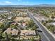 Wide aerial view of the home with a desert landscape, close to the city and main streets at 5555 W Desert Inn Rd, Las Vegas, NV 89146