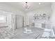 Bright bedroom featuring a daybed, a rocking horse, shelving, and an ornate chandelier at 5555 W Desert Inn Rd, Las Vegas, NV 89146