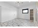 Bright bedroom with decorative lighting and floor-to-ceiling closet at 5555 W Desert Inn Rd, Las Vegas, NV 89146