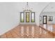 Formal dining room featuring tile floors, a chandelier, and natural light at 5555 W Desert Inn Rd, Las Vegas, NV 89146