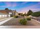 Charming single-story home with desert landscaping and walkway leading to the entrance at 5555 W Desert Inn Rd, Las Vegas, NV 89146