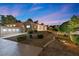 Single-story home featuring desert landscaping with walkway and exterior lighting at 5555 W Desert Inn Rd, Las Vegas, NV 89146