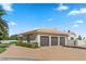 Attached three-car garage with a wide driveway and manicured landscaping at 5555 W Desert Inn Rd, Las Vegas, NV 89146