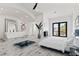 Bright main bedroom with a soaking tub, large windows, and modern furnishings at 5555 W Desert Inn Rd, Las Vegas, NV 89146