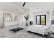 Bright main bedroom featuring high ceilings, natural light, and an ensuite bathroom at 5555 W Desert Inn Rd, Las Vegas, NV 89146