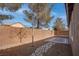 Landscaped backyard featuring a stone path and patio at 5600 Nimes Ave, Las Vegas, NV 89141