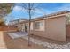 Spacious backyard with patio, landscaping, and stone pathway at 5600 Nimes Ave, Las Vegas, NV 89141