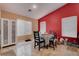 Small dining area with table and chairs near a window at 5600 Nimes Ave, Las Vegas, NV 89141