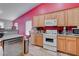 Bright kitchen featuring wood cabinets and modern appliances at 5600 Nimes Ave, Las Vegas, NV 89141