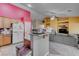 Kitchen with wood cabinets and a breakfast bar at 5600 Nimes Ave, Las Vegas, NV 89141