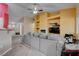 Living room with gray sofa and built-in entertainment center at 5600 Nimes Ave, Las Vegas, NV 89141