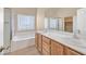 Bathroom with double vanity, soaking tub, and shower at 5725 Copper Sun Ct, North Las Vegas, NV 89031