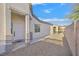 Front entrance with white door and gravel pathway at 5725 Copper Sun Ct, North Las Vegas, NV 89031