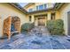 Inviting courtyard with stone tile and tranquil seating area at 5895 S Gateway Rd, Las Vegas, NV 89120