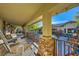 Relaxing covered patio with comfortable seating and courtyard views at 5895 S Gateway Rd, Las Vegas, NV 89120