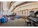 Spacious home office features exposed beams, large windows, and ample built-in shelving at 5895 S Gateway Rd, Las Vegas, NV 89120