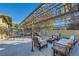 Outdoor patio area with seating and a metal covered structure at 5895 S Gateway Rd, Las Vegas, NV 89120