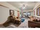 Cozy playroom with leather furniture and a carpeted floor at 5895 S Gateway Rd, Las Vegas, NV 89120