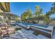 Inviting pool and spa area with lounge chairs and umbrellas at 5895 S Gateway Rd, Las Vegas, NV 89120