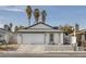 Updated single story home with attached garage and front yard at 59 N Christy Ln, Las Vegas, NV 89110