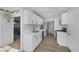 Modern kitchen with white shaker cabinets and stainless steel appliances at 59 N Christy Ln, Las Vegas, NV 89110