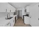 Modern kitchen with white shaker cabinets and stainless steel appliances at 59 N Christy Ln, Las Vegas, NV 89110