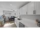 Modern kitchen with white shaker cabinets and stainless steel appliances at 59 N Christy Ln, Las Vegas, NV 89110