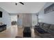 Living room with gray sectional sofa and a fireplace at 59 N Christy Ln, Las Vegas, NV 89110