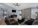 Living room with gray sectional sofa and a fireplace at 59 N Christy Ln, Las Vegas, NV 89110