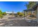 Large backyard with gravel landscaping and pergola at 5981 Doubletree Rd, Pahrump, NV 89061