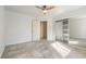 Bedroom with mirrored closet and ceiling fan at 5981 Doubletree Rd, Pahrump, NV 89061