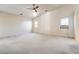 Large bedroom with ceiling fan and carpet flooring at 5981 Doubletree Rd, Pahrump, NV 89061