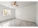 Bright bedroom with ceiling fan and carpet at 5981 Doubletree Rd, Pahrump, NV 89061