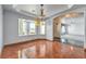 Bright dining room with hardwood floors, chandelier, and view to living room at 5981 Doubletree Rd, Pahrump, NV 89061