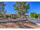 Single-story house with a two-car garage and landscaped yard at 5981 Doubletree Rd, Pahrump, NV 89061