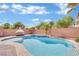 Refreshing freeform pool with a large patio area at 6145 Sydney Bay Ct, North Las Vegas, NV 89081