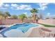 Inviting kidney shaped pool, fire pit, and palm trees at 6145 Sydney Bay Ct, North Las Vegas, NV 89081