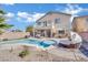 Home with a large, kidney-shaped pool and spacious backyard at 6145 Sydney Bay Ct, North Las Vegas, NV 89081