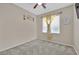 Bedroom with ceiling fan and yellow curtains at 6145 Sydney Bay Ct, North Las Vegas, NV 89081