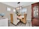 Elegant dining room with chandelier and wood flooring at 6145 Sydney Bay Ct, North Las Vegas, NV 89081