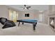 Game room featuring a pool table, fireplace, and massage chair at 6145 Sydney Bay Ct, North Las Vegas, NV 89081