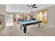 Gathering room with a pool table and access to the kitchen at 6145 Sydney Bay Ct, North Las Vegas, NV 89081